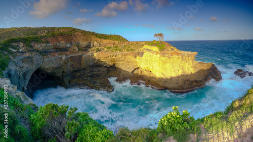 Summer evening light on the sea cave at Snapper Point in Frazer Park within the Munmorah State Conservation Area, Central Coast, Australia