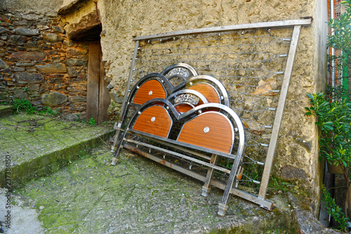 An old bed on the street, moving house. A village at Las Hurdes region of the north of Caceres province, Extremadura, Spain photo