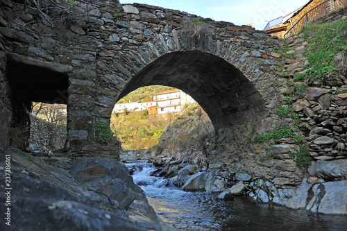 Medieval stone bridge over the river Hurdano in Casarrubia village. Las Hurdes is a mountanious region of the north of Caceres province, Extremadura, Spain