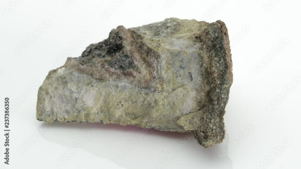 Hematite, also spelled as haematite, is the mineral form of iron (III) oxide, from Vesuvius volcano isolated on a white background, Naples, Italy Hematite, also spelled as haematite, is the mineral form of iron (III) oxide, from Vesuvius volcano isolated on a white background, Naples, Italy