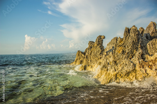 sea waves crushing on shore line stone rocks south Mediterranean landscape summer vacation wallpaper concept