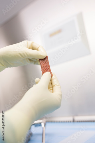 Scientist processing skin graft in laboratory