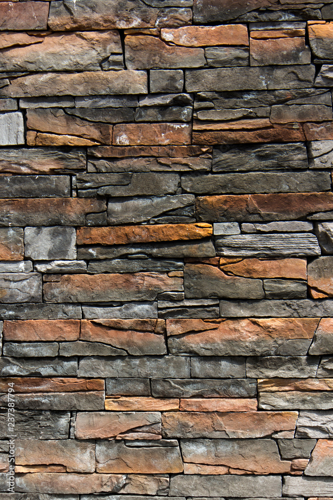 Fototapeta premium Wall grey and beige stones vertical