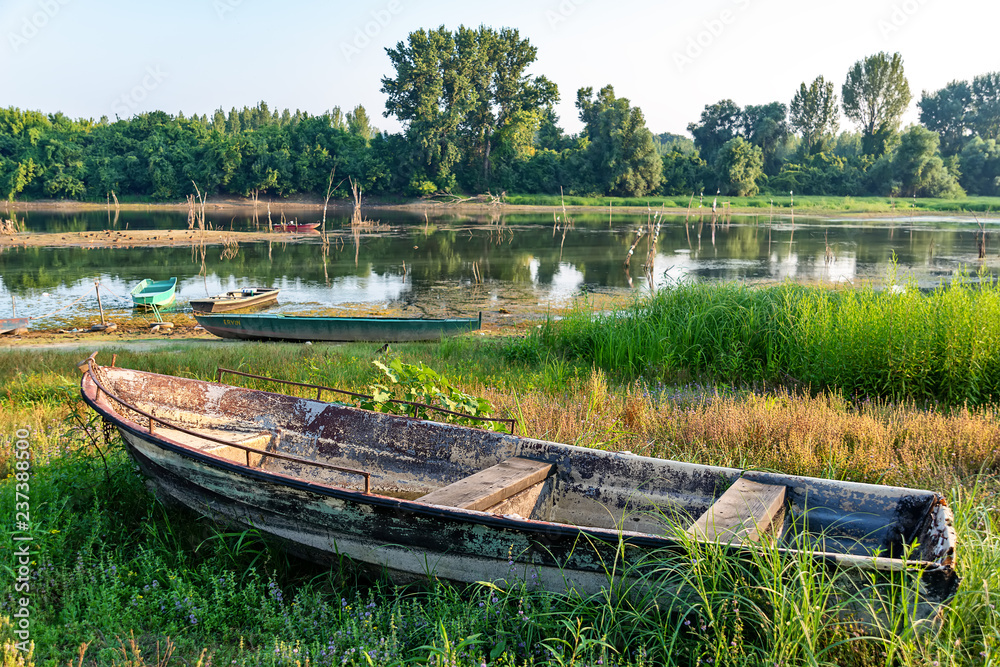 Naklejka premium The abandoned boat on the Danube coast 