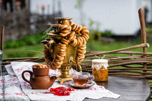 Slika na platnu Russian samovar with tea and donuts on a wooden table
