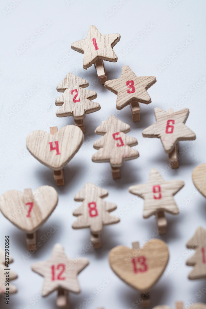 Festive Christmas advent calendar made from wooden shapes Festive Christmas advent calendar made from wooden shapes
