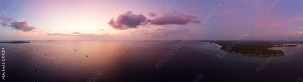 Aerial view tropical beach island reef caribbean sea dramatic sky at sunset sunrise. Indonesia Moluccas archipelago, Kei Islands, Banda Sea. Top travel destination, diving snorkeling
