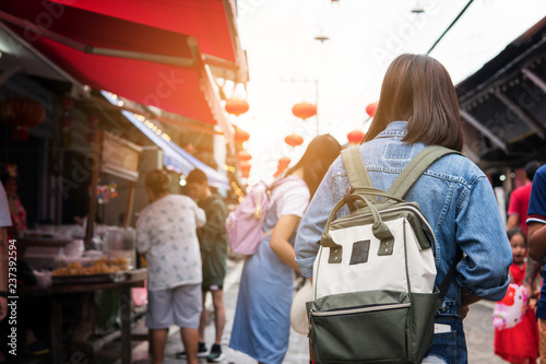 Photography Asian women traveler in china market. she is shopping and travel.