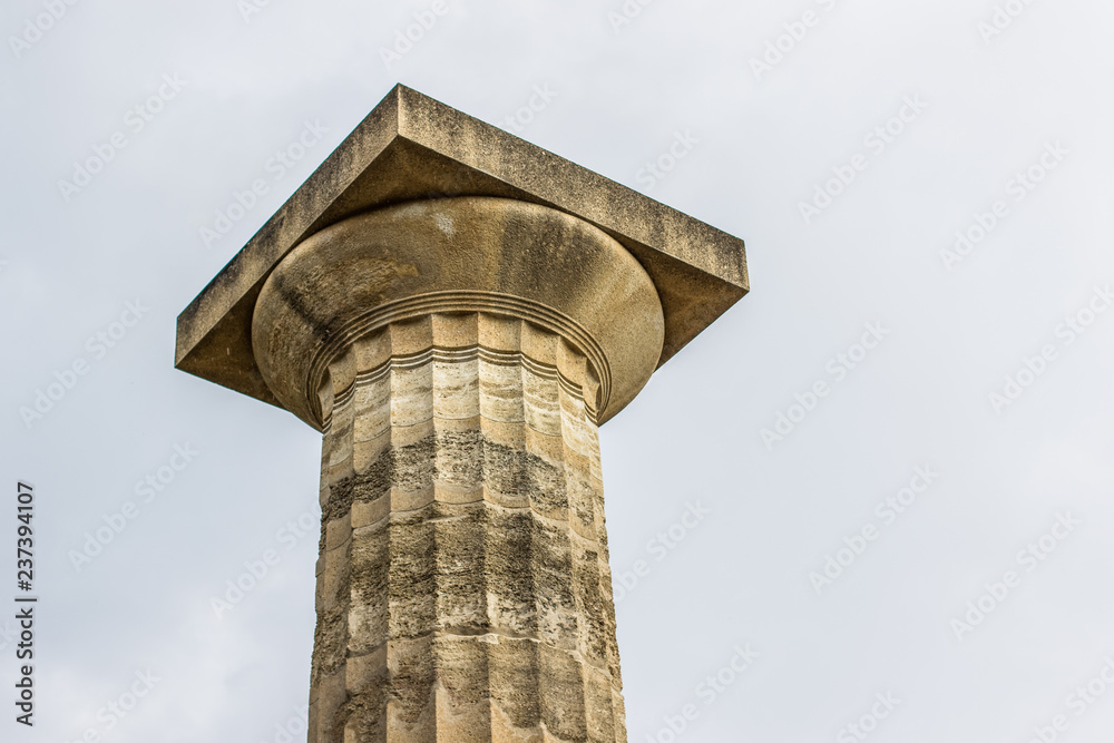 column antique architecture object on gray rainy cloudy sky with empty space for copy or text