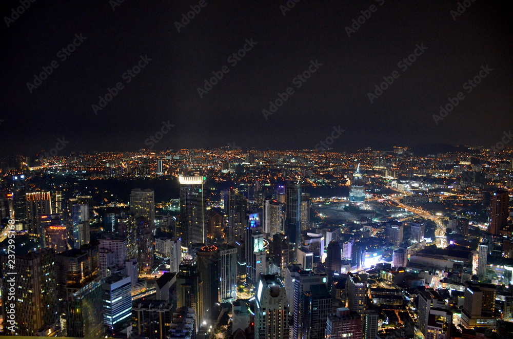 Top view of the night city of Kuala Lumpur from the Menara Tower, Malaysia. Panorama