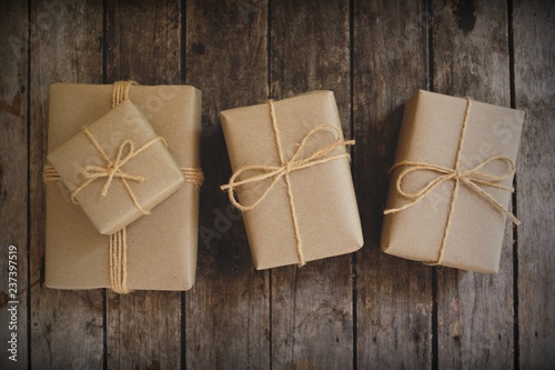 Eco friendly gift boxes wrapped with brown paper, green happy new year present concept