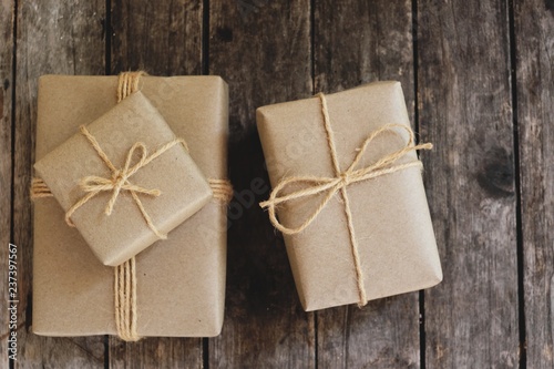 Eco friendly gift boxes wrapped with brown paper, green happy new year present concept