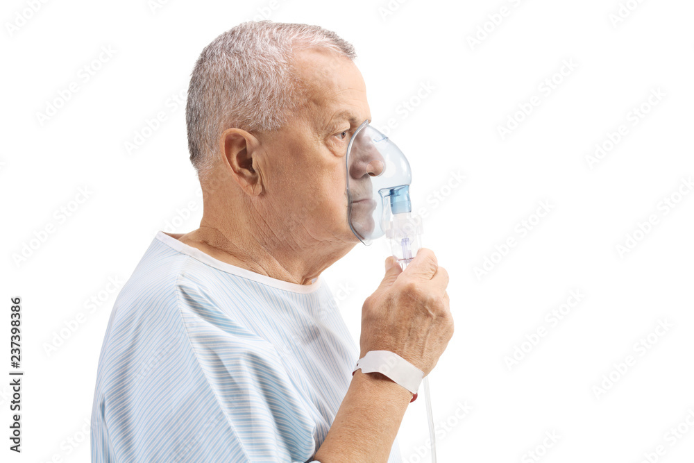Elderly patient with an inhalation mask Elderly patient with an inhalation mask