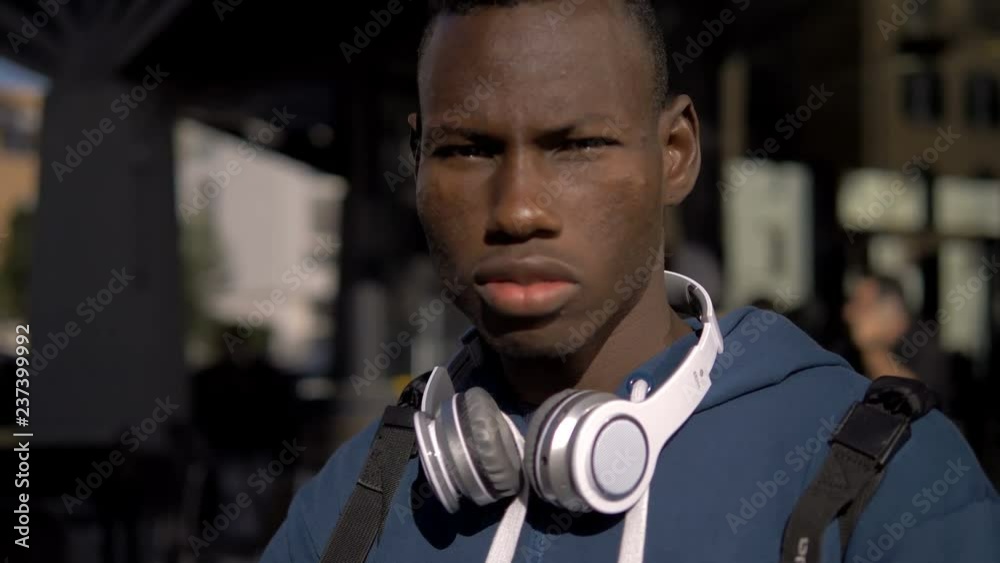 Proud confident american african man in the street,staring at camera Proud confident american african man in the street,staring at camera