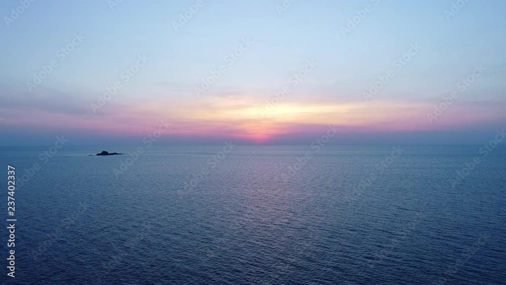 Drone flying over sea in sunset evening time Drone flying over sea in sunset evening time
