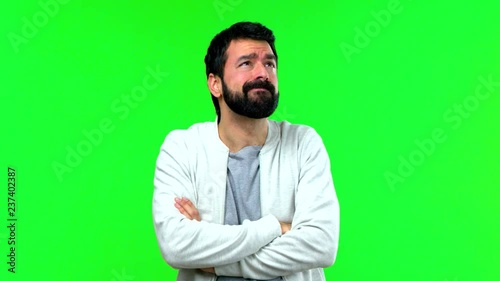 Man with beard on green screen chroma key background