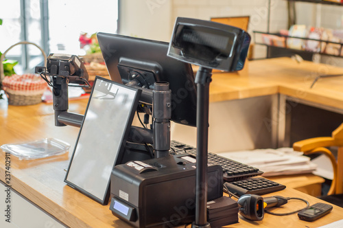 Cash register with barcode reader in grocery store photo