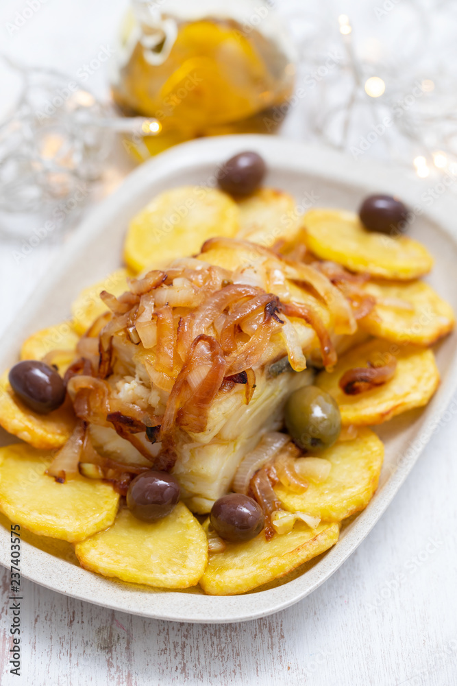 baked cod fish with potato, onion and olives