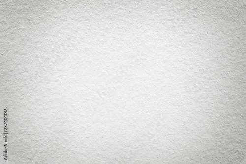 Texture of old light white paper background, closeup. Structure of dense cardboard.