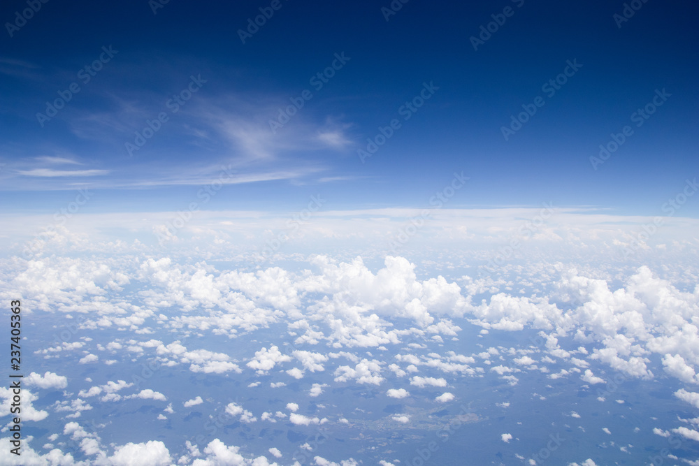 Blue sky cloud background.aerial view abstract beautiful sky over the ocean from airplane window