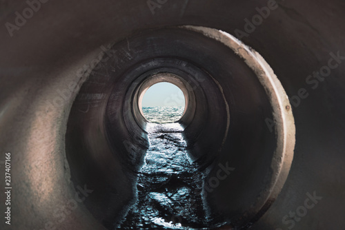 Sewage flows into the sea. Inside view of the pipe.