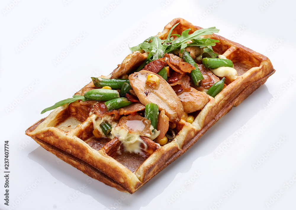Belgian waffle on a white background. Stuffed with chicken, asparagus and arugula Belgian waffle on a white background. Stuffed with chicken, asparagus and arugula