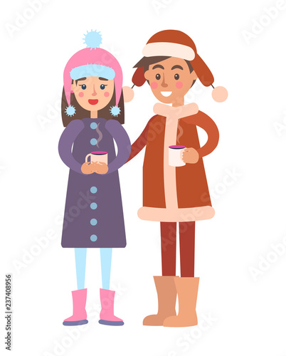Girl and Boy in Warm Winter cloth Cups of Hot Tea