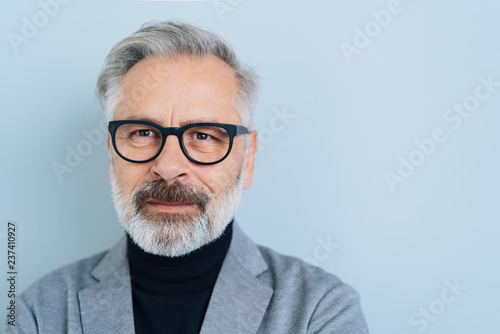 Thoughtful serious bearded businessman