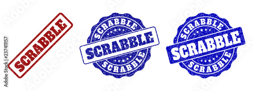 SCRABBLE scratched stamp seals in red and blue colors. Vector SCRABBLE marks with scratced effect. Graphic elements are rounded rectangles, rosettes, circles and text captions.