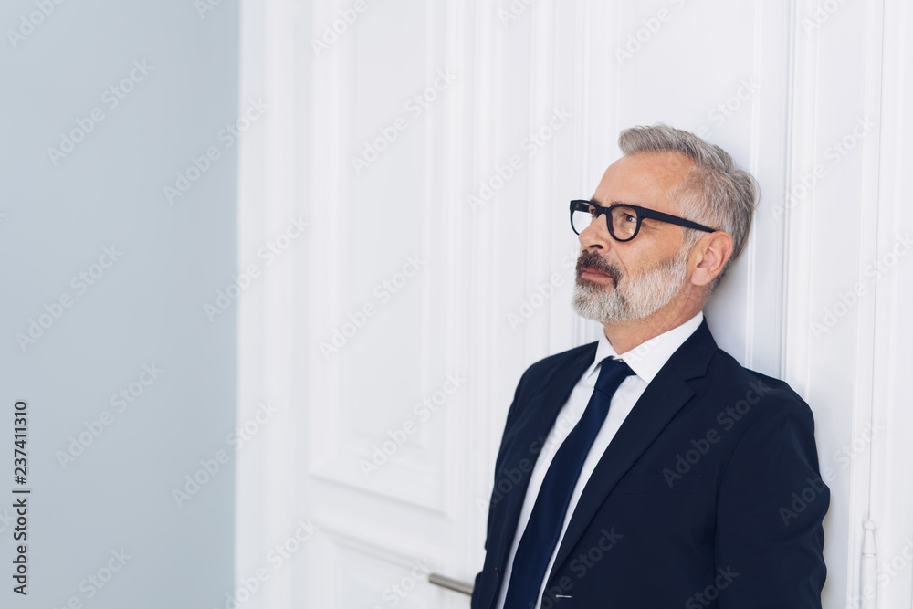 Serious middle-aged businessman thinking of future Serious middle-aged businessman thinking of future