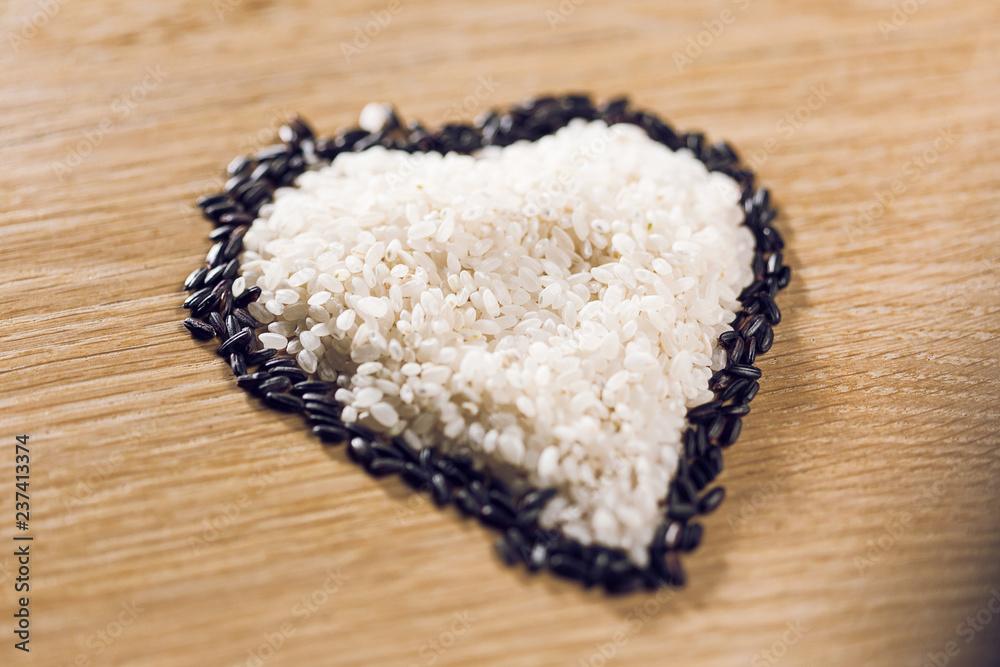 Rise and black seeds in shape of a heart Rise and black seeds in shape of a heart
