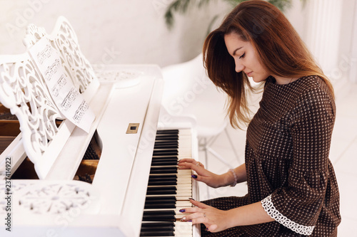 Closeup of woman playing the piano