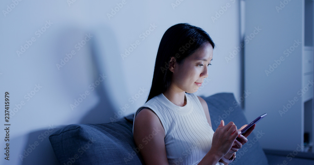 Obraz premium Woman use of mobile phone at home