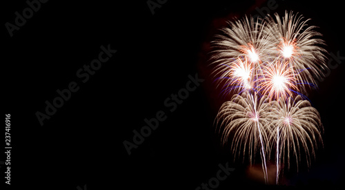 Real fireworks, long exposure, cropped and close up on black background with copy space