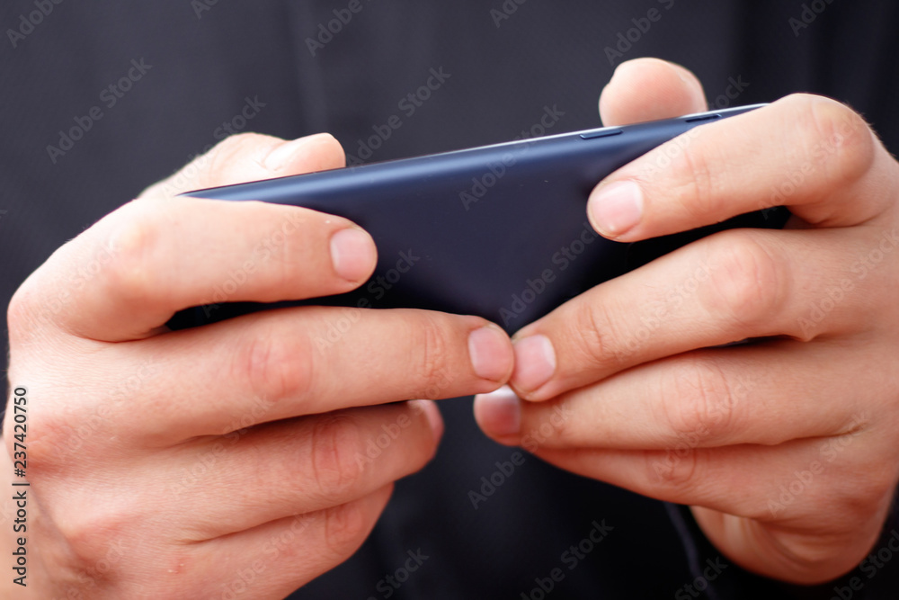 lifestyle young man using a mobile phone with texting message on app smartphone, playing social network and shopping online lifestyle young man using a mobile phone with texting message on app smartphone, playing social network and shopping online