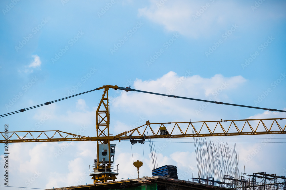 Developing countries rely on machinery for their work.Crane is a machine used in construction.