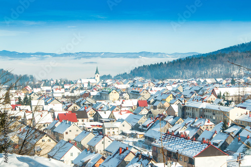     Croatia, Gorski kotar, town of Delnice in winter, panoramic view, houses under snow  photo