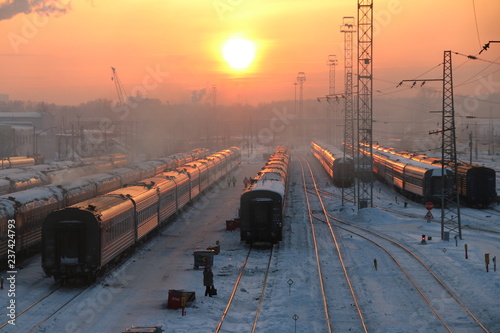 Fotografie Freight trains on winter and sunset on station
