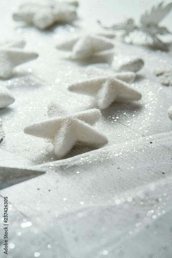 Christmas and happy new year decorations of white snowflakes on a white brocade background. Christmas and happy new year decorations of white snowflakes on a white brocade background.