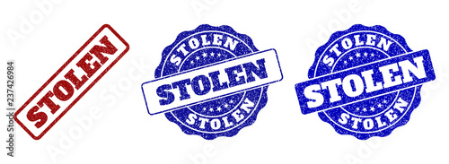 STOLEN scratched stamp seals in red and blue colors. Vector STOLEN imprints with distress effect. Graphic elements are rounded rectangles, rosettes, circles and text titles.