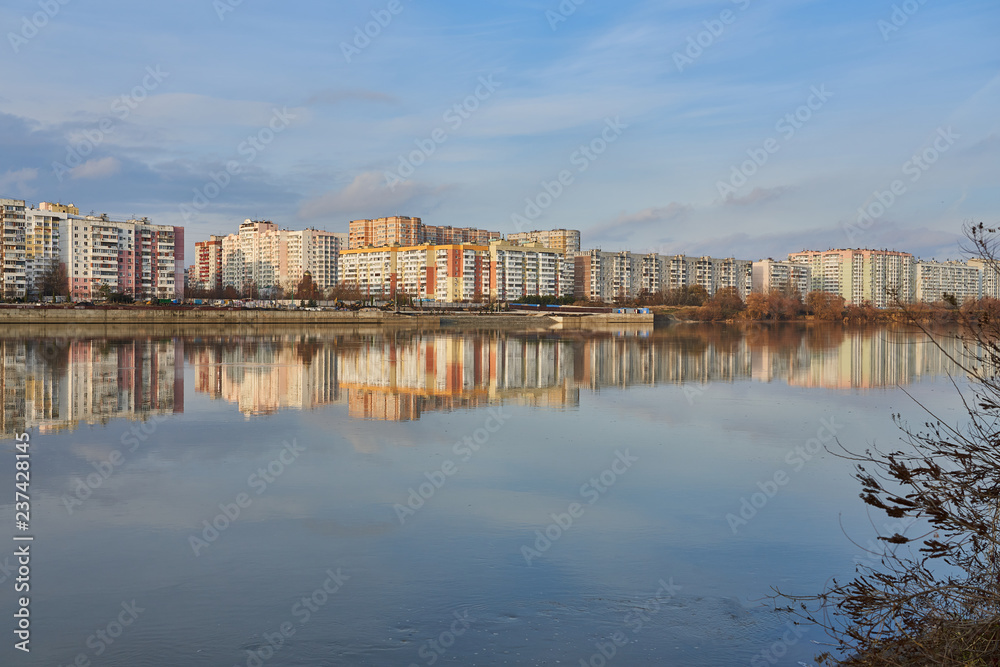 Microdistrict in the West of Krasnodar and its reflection in the Kuban River during the golden hours. Two worlds in one place.
