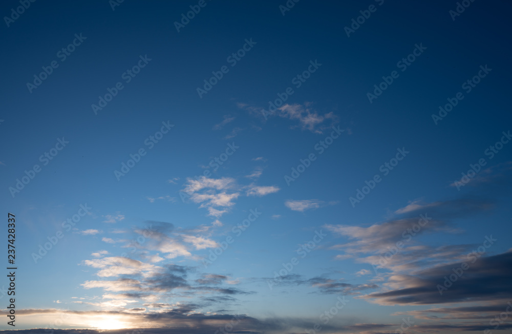 Beautiful clouds with blue sky background with part of clear sky background. Nature weather, cloud blue sky and sun / sunrise and sunset concept / sky texture / mapping