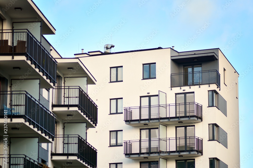 Modern apartment buildings on a sunny day with a blue sky. Facade of a modern apartment building