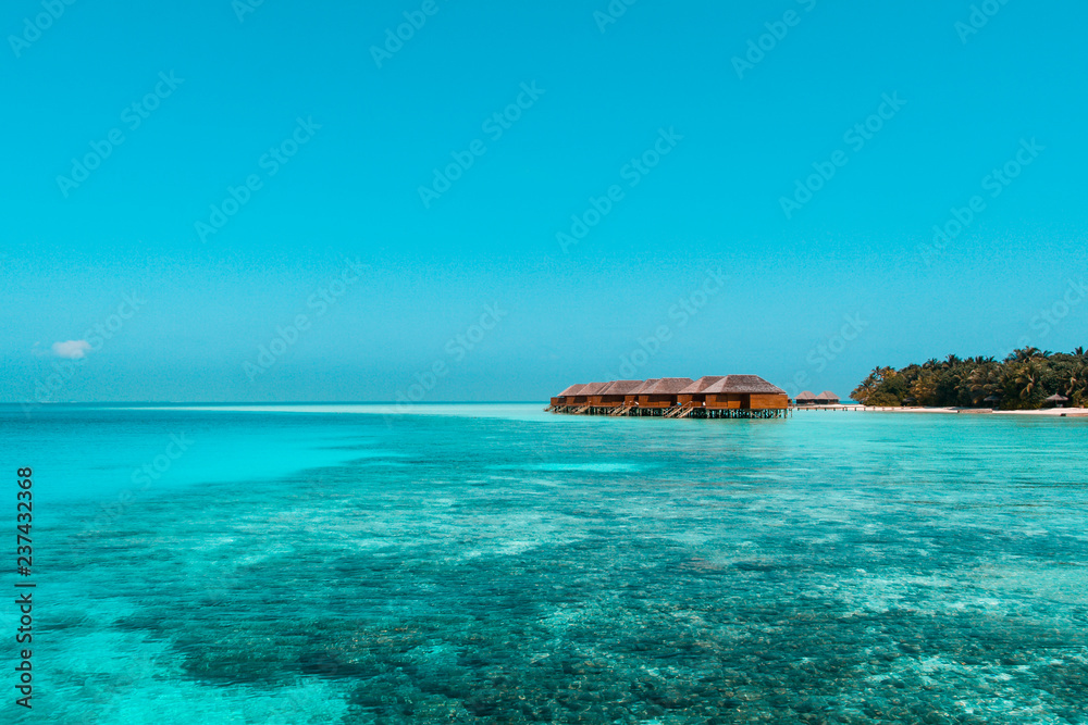 Fototapeta premium Beautiful beach with water bungalows or water villas at Maldives
