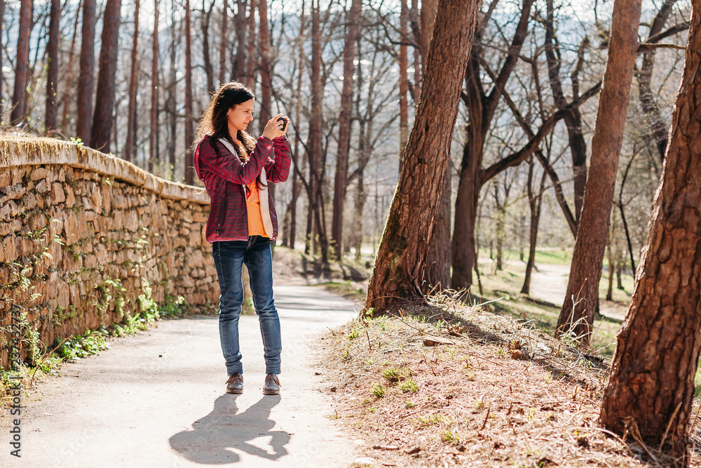 woman tourist taking pictures of beautiful views woman tourist taking pictures of beautiful views