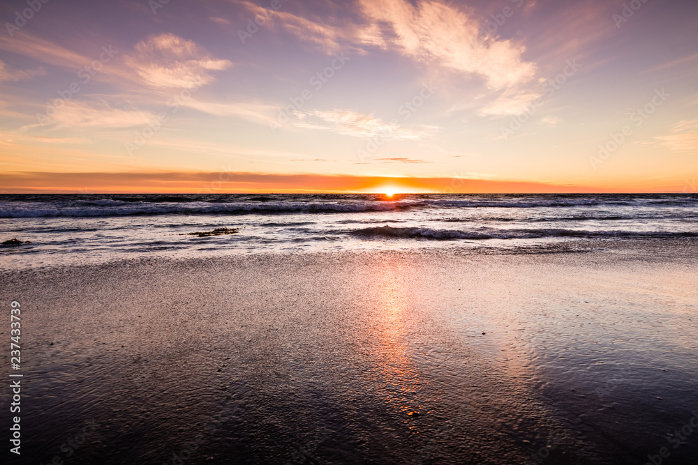 Sunset view of Malibu beach, the Pacific Ocean coastline, Los Angeles county, California