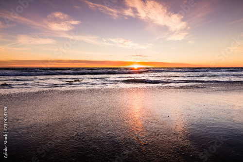 Fototapeta Naklejka Na Ścianę i Meble -  Sunset view of Malibu beach, the Pacific Ocean coastline, Los Angeles county, California