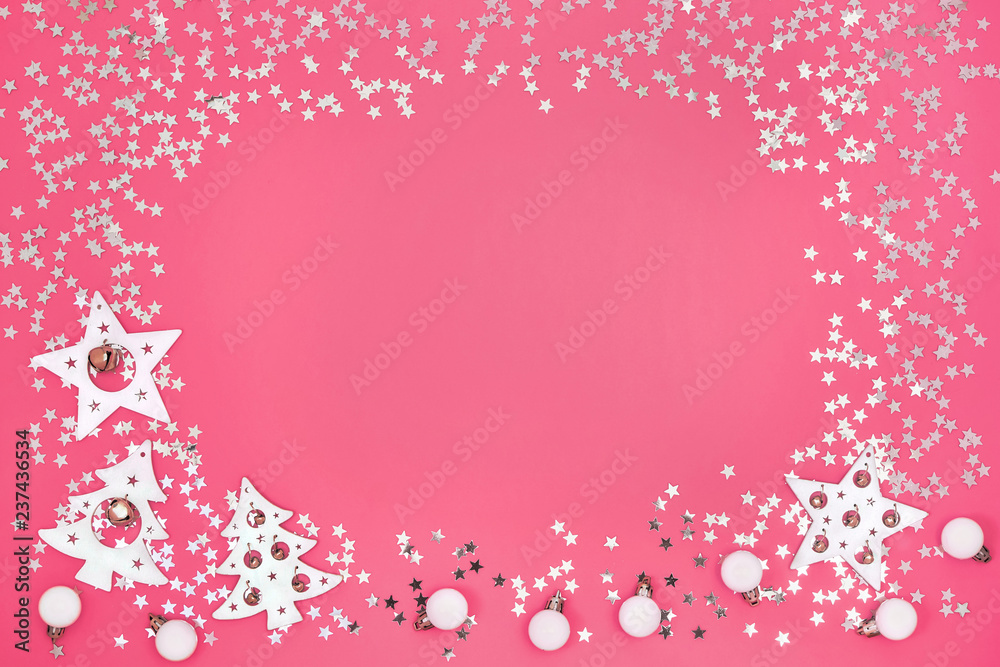Christmas card. Christmas white and silver ornaments on bright pink background. Copy space, top view. Flat lay Christmas card. Christmas white and silver ornaments on bright pink background. Copy space, top view. Flat lay