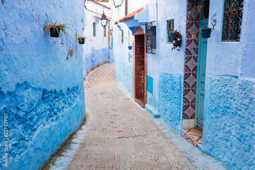 narrow street in blue city Chefchaouen in Morocco © sergejson