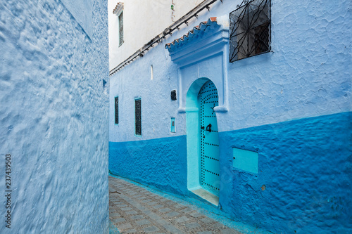 street with emerald door in blue city Chefchaouen in Morocco © sergejson